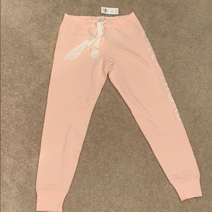 Light pink, sweatpants.